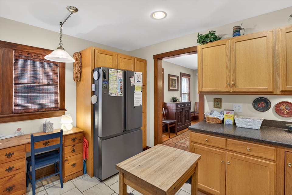 Kitchen with Double Door Refrigerator and Desk