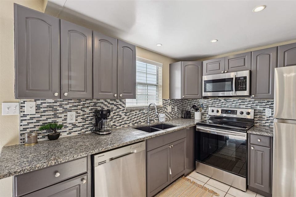 A sleek, fully equipped kitchen with modern appliances and stylish finishes makes cooking effortless.