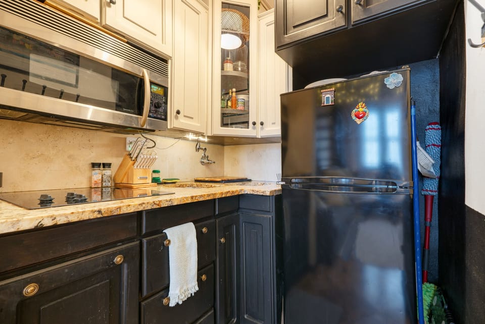This kitchen has all the essentials with cleaning supplies to make you feel right at home