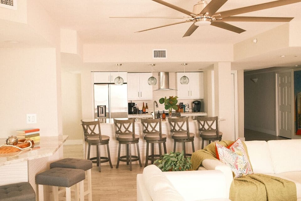 The heart of Island Time Too is our open-concept living space, where everything from sunrise pancakes to evening cocktails feels like a group event.