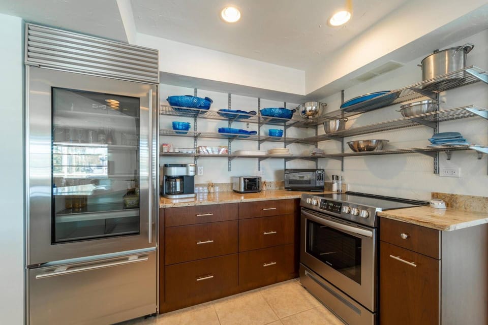The unique kitchen design offers lots of shelf space.