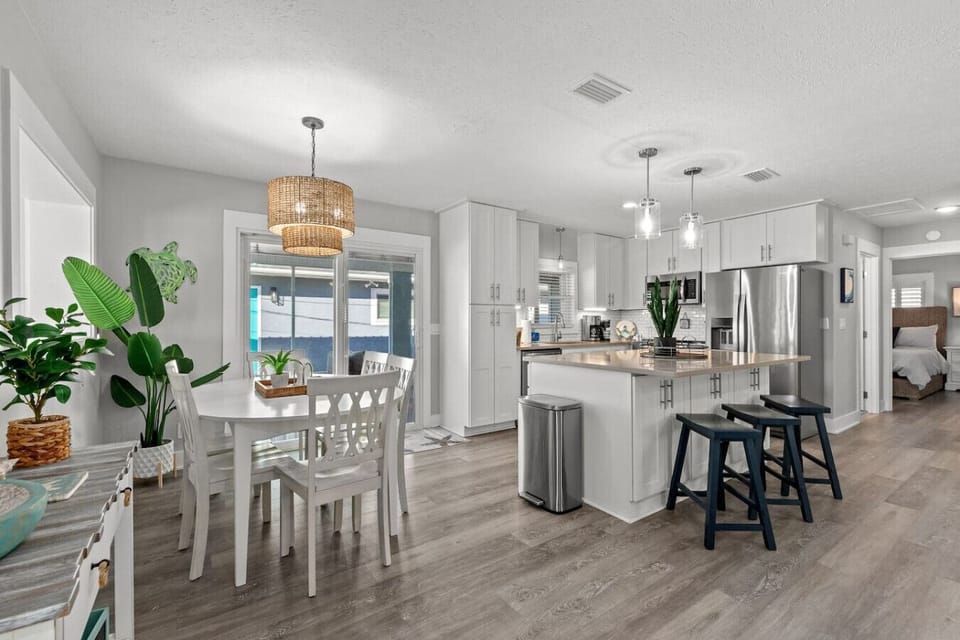 Bright and sleek kitchen with cozy dining area!