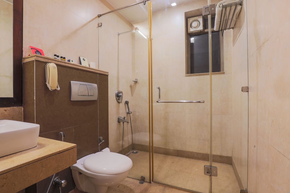 Shower, free toiletries, hair dryer, slippers