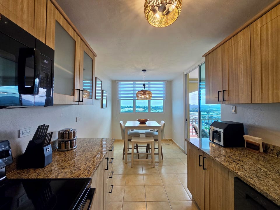 Modern kitchen with granite counters and bar seating