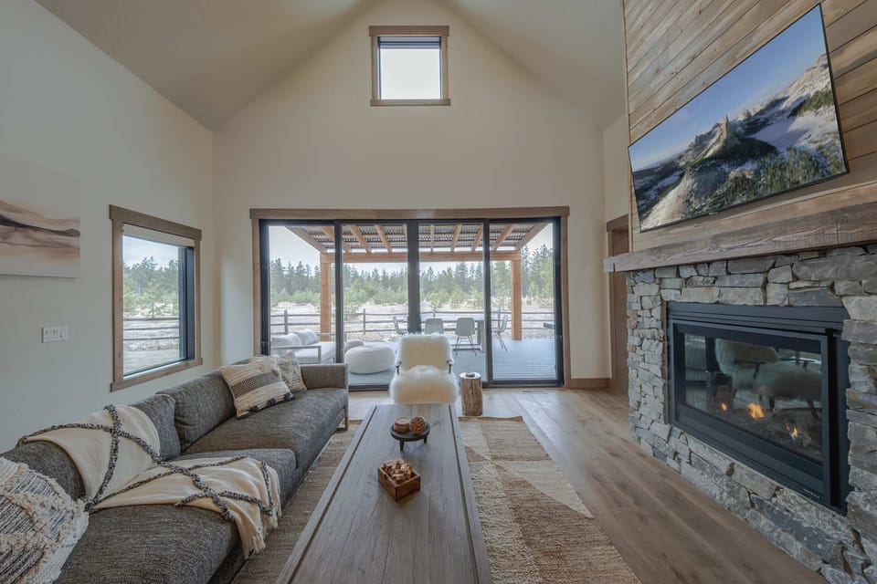 Curl up in the cozy living room & stream your favorites by the fireplace