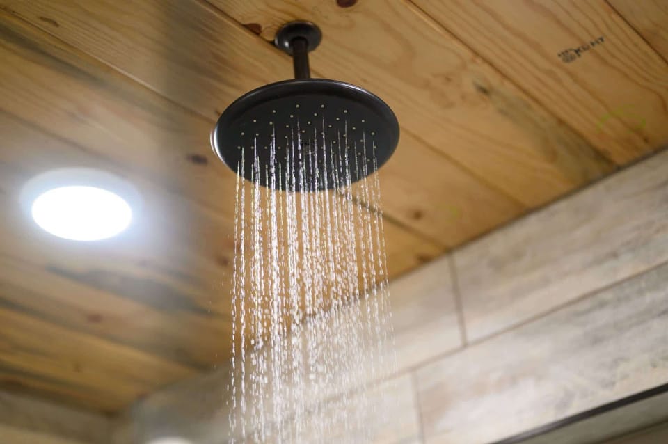 The elegant king ensuite features a glass shower, soaking tub, & dual vanities