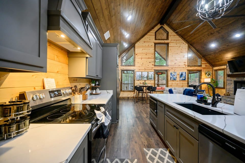 The chic, open kitchen offers ample space & every home comfort
