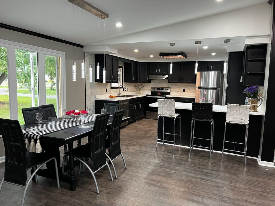 Enjoy our modern gourmet kitchen, dining and bar area