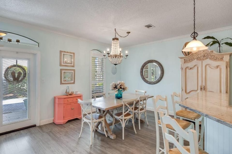 As you enter, you're greeted by the comfortably furnished dining area & kitchen