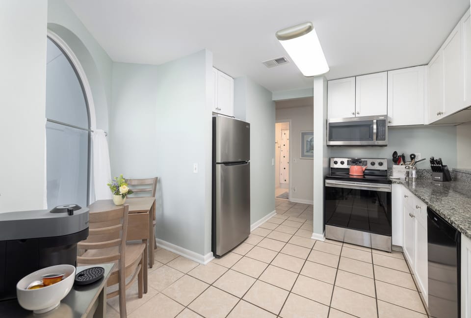 Airy Kitchen with updated appliances and ample counter space