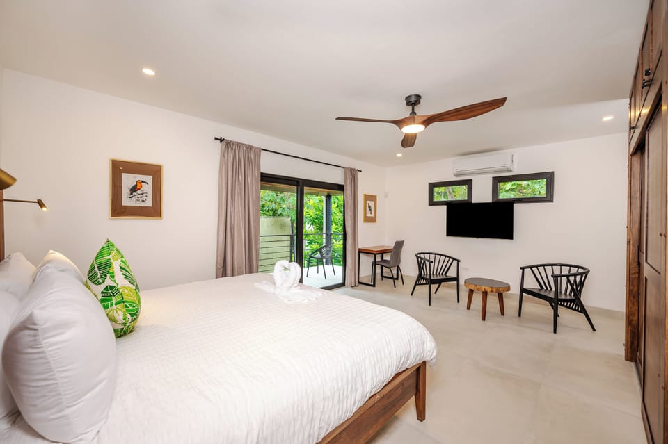 Principal Bedroom -King Size Bed, Sitting area, SMART TV and Private Balcony