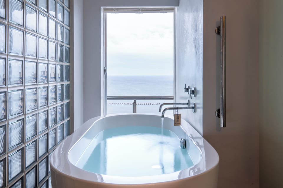 Design Double Room, 1 Queen Bed, Non Smoking, Sea View | Bathroom | Spring water tub, free toiletries, hair dryer, slippers