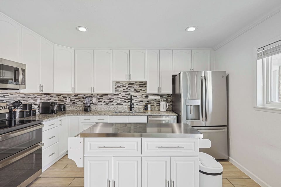 Kitchen with convenient bar area for casual meals or drinks.