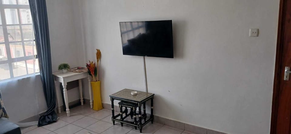 Family Apartment, City View | Living area | Smart TV
