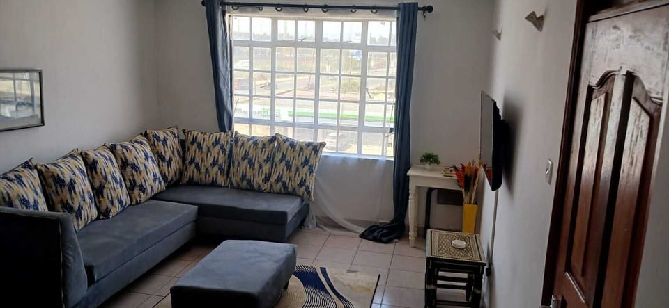 Family Apartment, City View | Living area | Smart TV