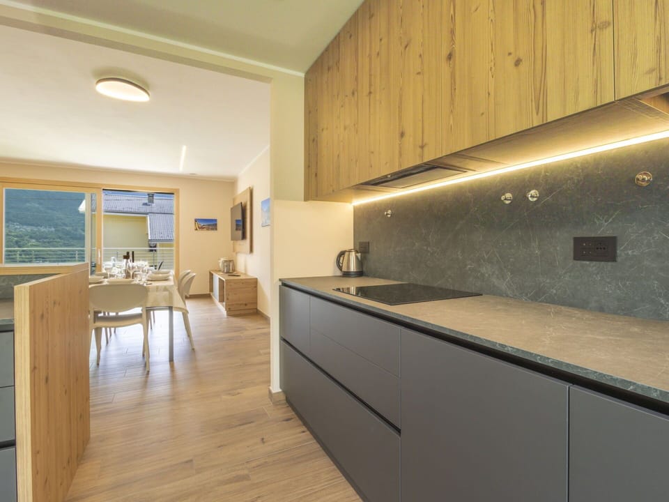 Interior Design, Ceiling, Kitchen, Flooring, Countertop, Room, Floor, Cabinetry, Light Fixture, Tap