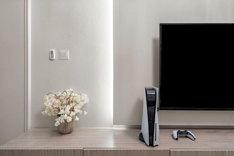 Entertainment Hub: Unwind with a sleek gaming setup and modern decor for your downtime fun!