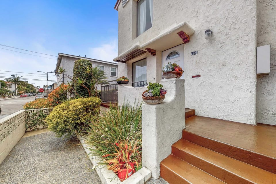 Front of the building.  Your unit is to the left, with your own patio to enjoy your morning coffee!