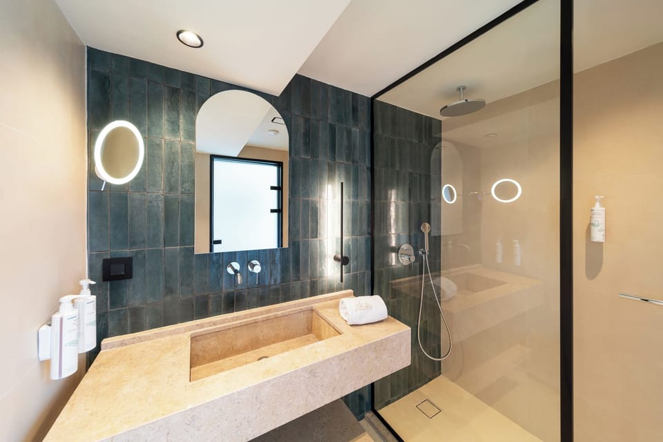 Shower, rainfall showerhead, designer toiletries, hair dryer