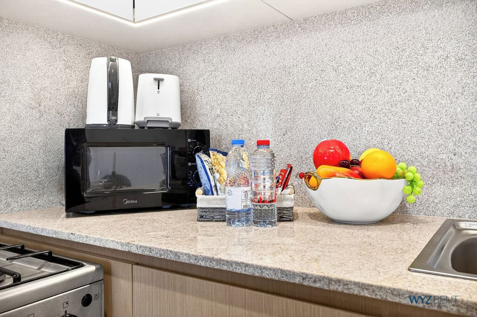 Apartment, Balcony, Canal View | Private kitchen | Coffee/tea maker, highchair