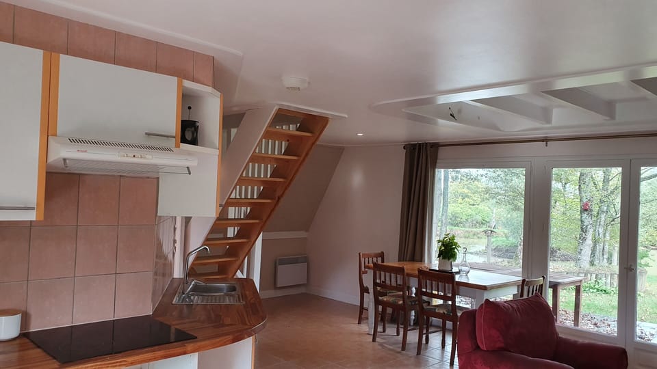 Dining area and stairs up to bedrooms
