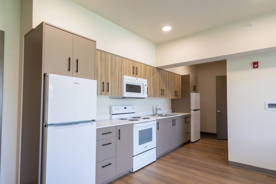 Family Suite | Private kitchen | Full-size fridge, oven, stovetop, dining table