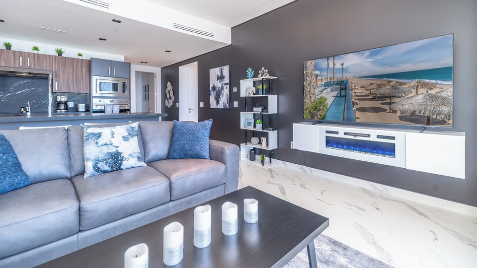 Large TV above the electric fireplace.