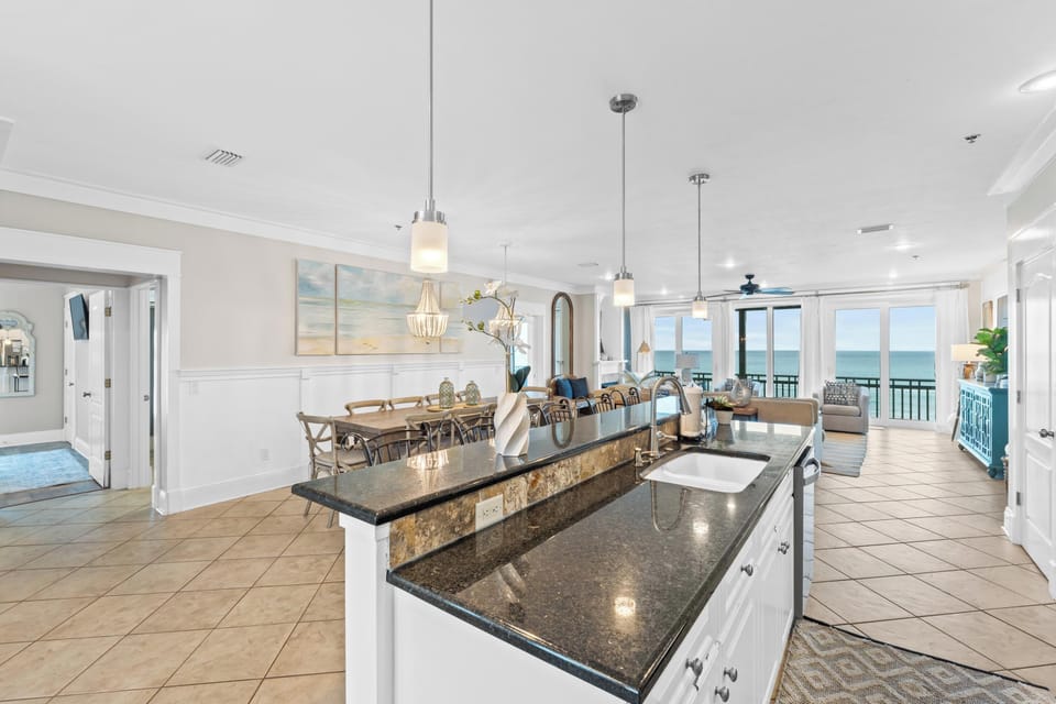 Entertain with ease in open spaces framed by floor-to-ceiling Gulf views