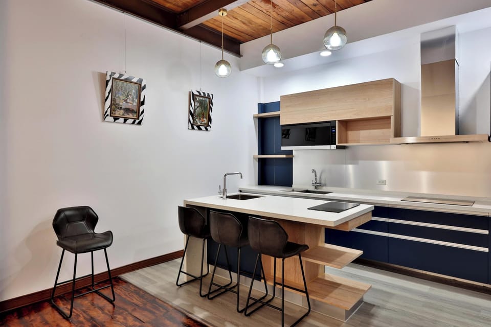 Deluxe Room | Private kitchen | Dining tables