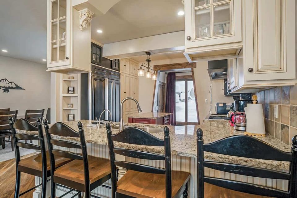 Start your day with coffee, conversation, and alpine views from this charming kitchen perch.