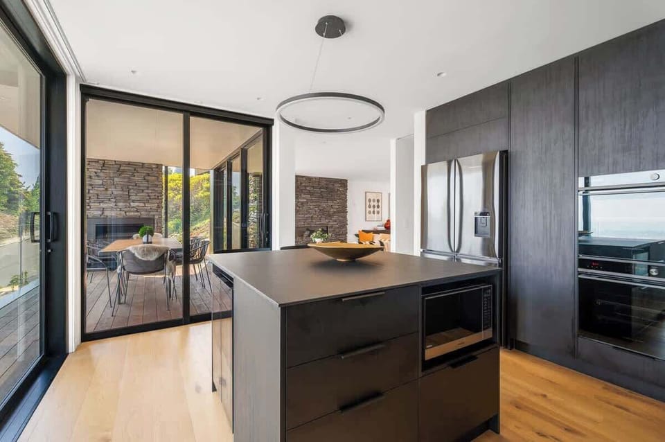 Spacious, Fully Equipped Kitchen
This spacious kitchen offers ample counter space and all the essentials for cooking, ensuring a seamless culinary experience.