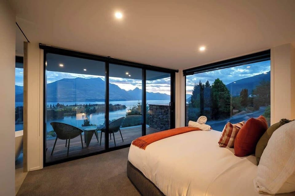 Master Bedroom with Ensuite and Private Patio
The spacious master bedroom features a luxurious ensuite and a private patio, perfect for relaxing while enjoying stunning lake and mountain views.