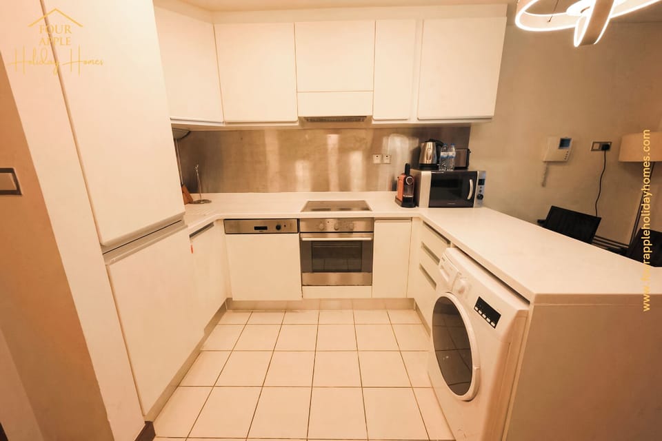 Luxury Studio Suite, Balcony, City View | Private kitchen | Full-size fridge, microwave, oven, stovetop