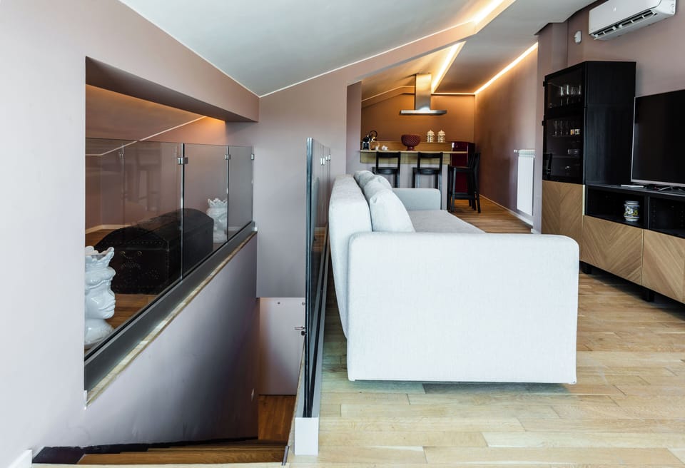 Deluxe Duplex | Living area | 35-inch TV with digital channels