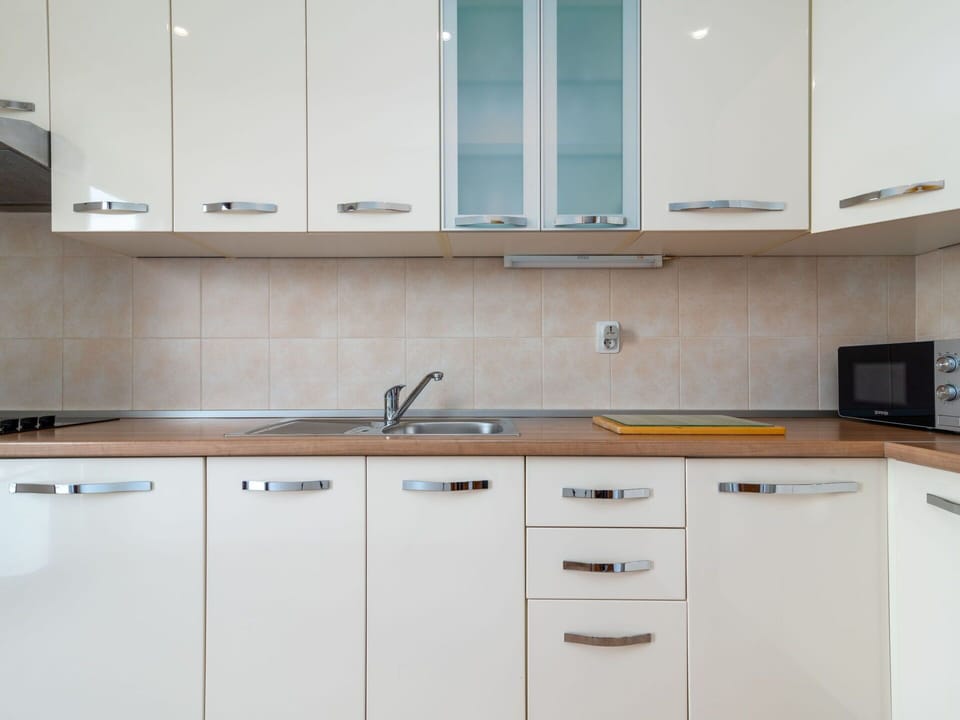 Cabinetry, Countertop, Kitchen, Wood, Flooring, Furniture, Interior Design, Kitchen Appliance, Drawer, Major Appliance