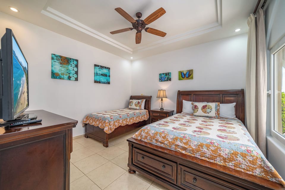 Second bedroom with one queen bed and one single bed 