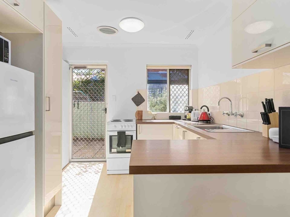 Enjoy cooking in a well-equipped space, with the added benefit of direct outdoor access for fresh air.