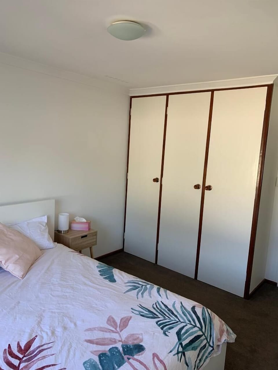 Keep your clothes organized! This bedroom features a large wardrobe for your convenience. 