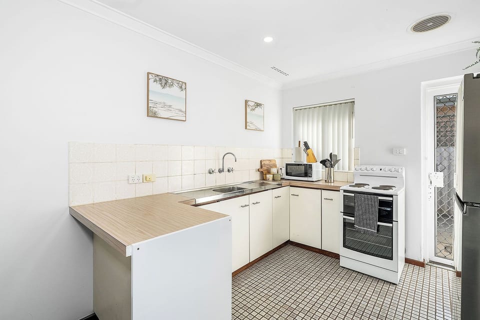 Simple, clean, and well-equipped. Our kitchen has all the essentials for your home-cooked favorites while away.