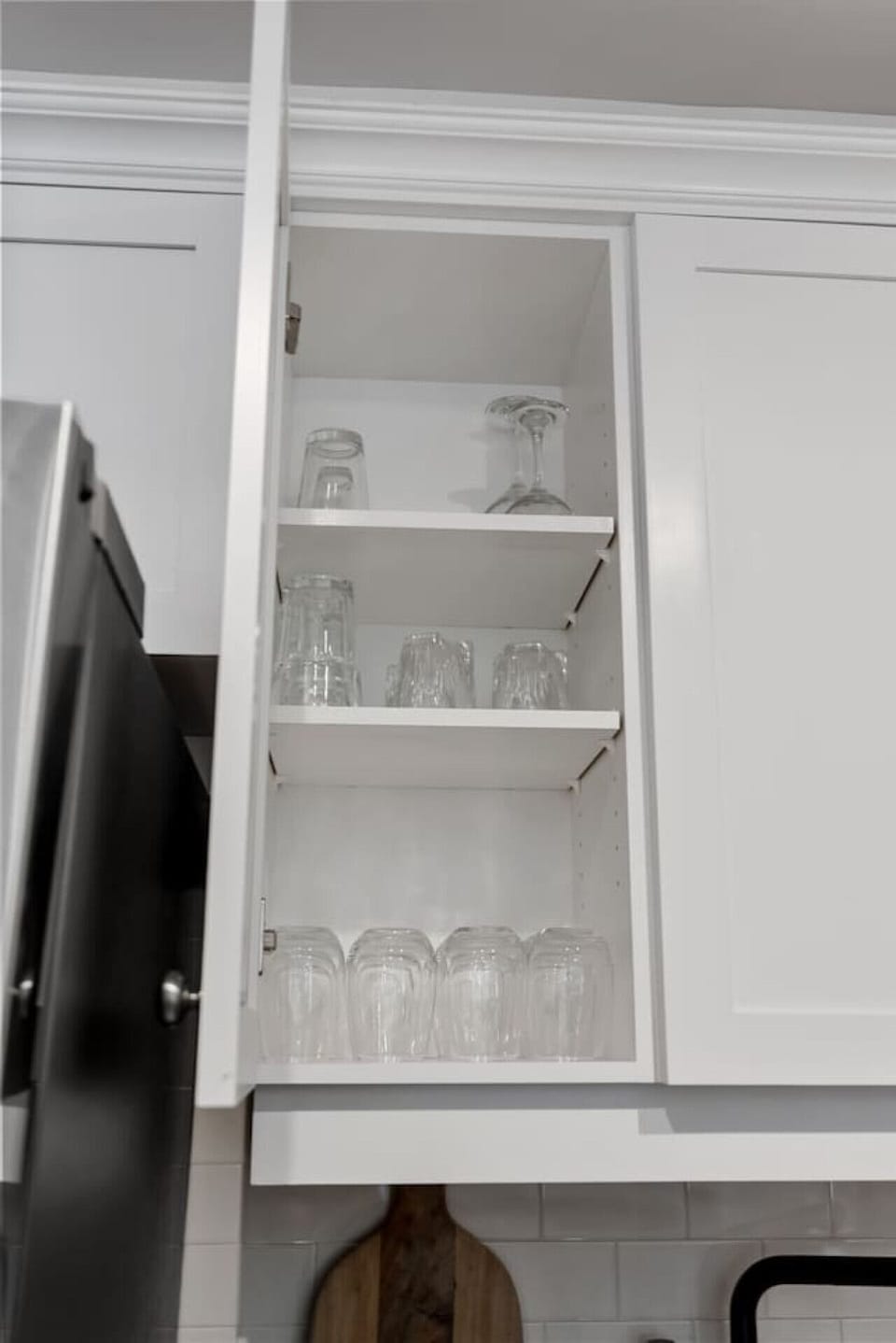 Kitchen cabinets stocked with cooking wares, glassware and silverwares, ideal for mixing up your favorite meals and drinks during your stay.