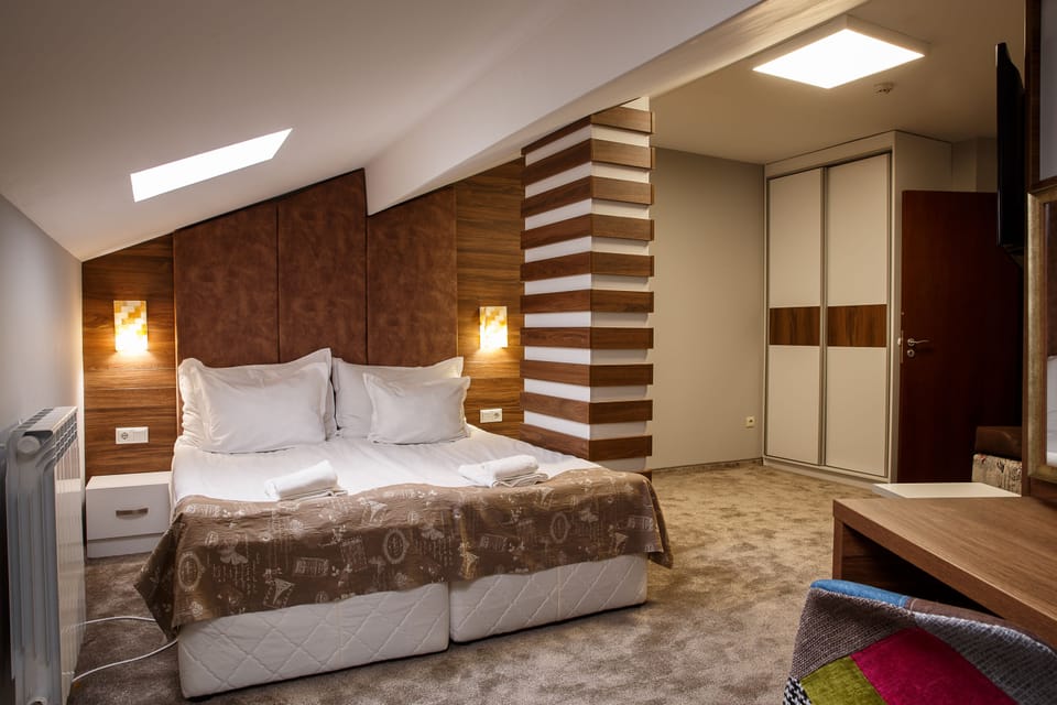 Deluxe Apartment, 2 Bedrooms | Minibar, desk, free WiFi, bed sheets