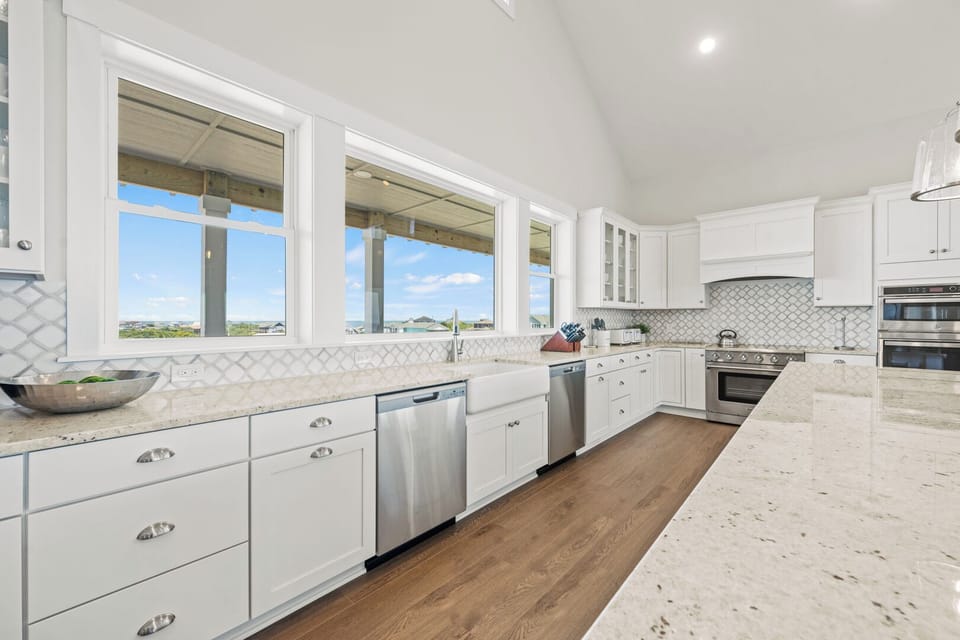 Large Kitchen with Bar Seating and Dual Refrigerators on Fourth Level