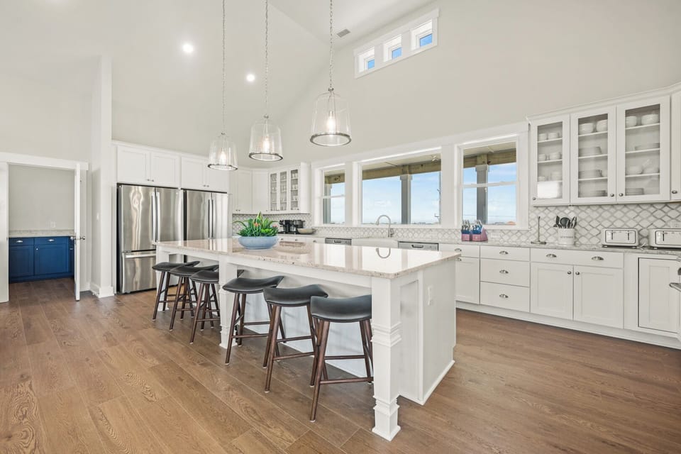 Large Kitchen with Bar Seating and Dual Refrigerators on Fourth Level