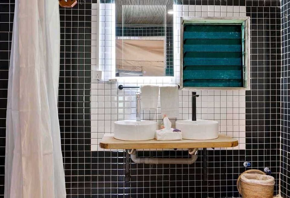Deluxe Room, Patio | Bathroom | Shower, towels, soap, shampoo