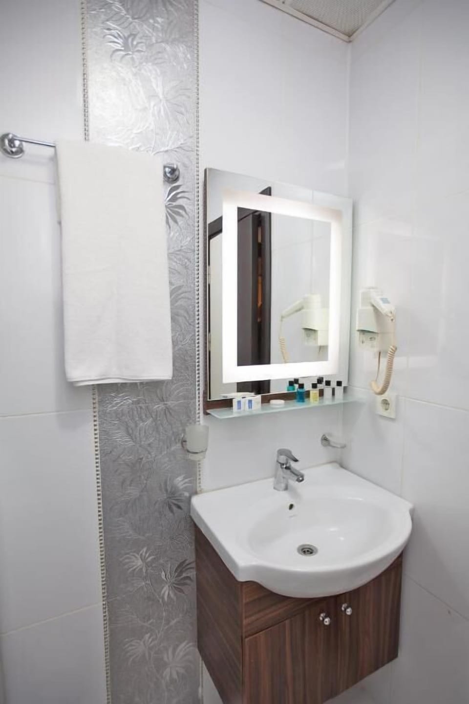 Shower, hair dryer, slippers, towels