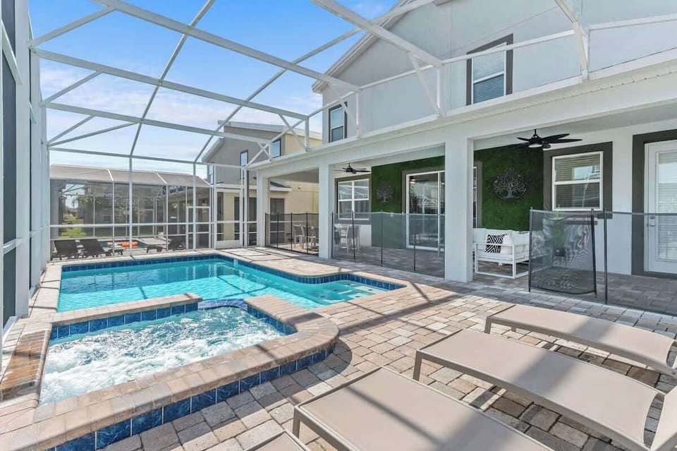Private pool and spa  with outdoor dinging table and, sun loungers & seating area