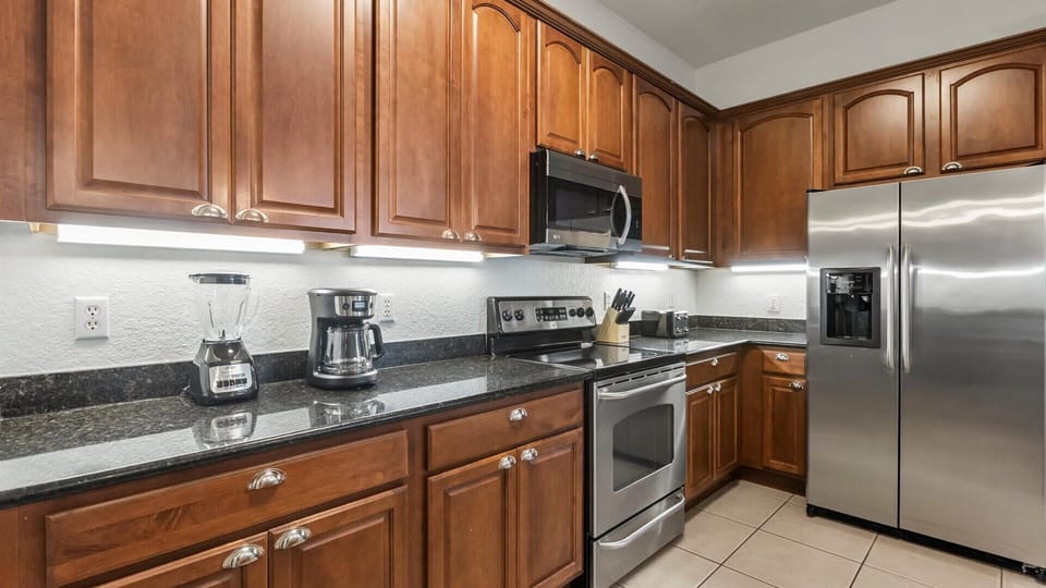 Fully-equipped family kitchen featuring silver appliances