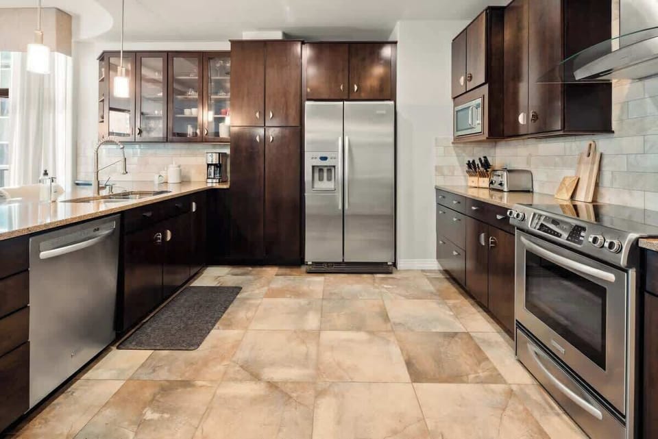 The kitchen has all appliances and utensils needed to cook a great meal.