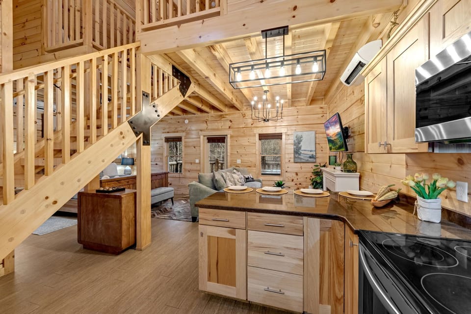 This warm, inviting kitchen has cozy wood tones and plenty of space to cook!