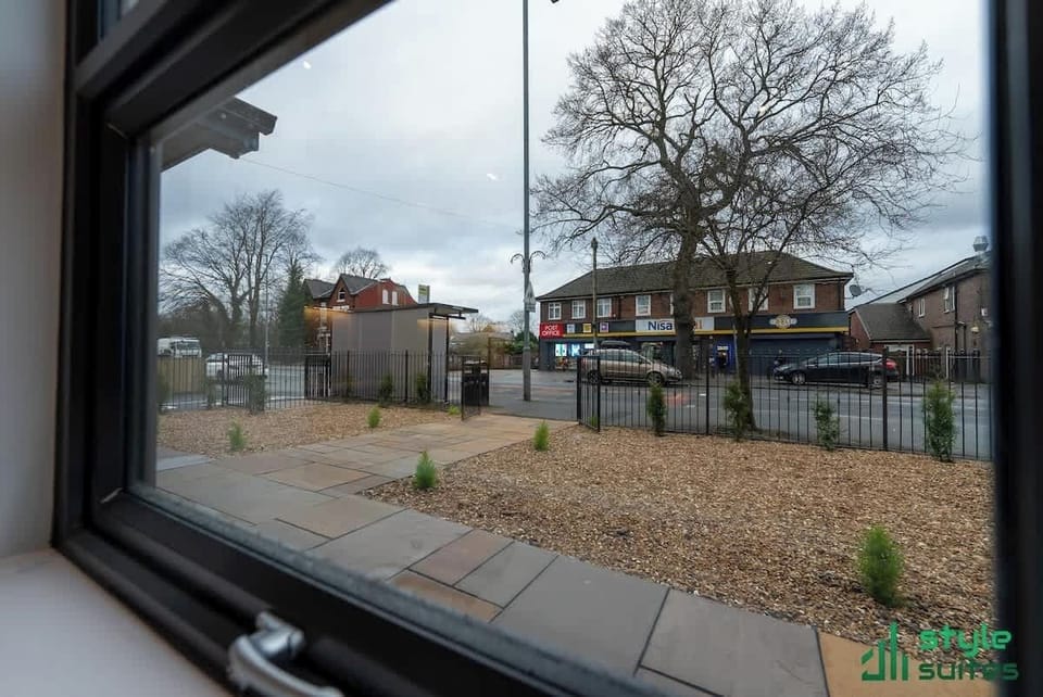 External view showing local shops & cafe..